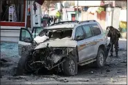  ?? (AP/Rahmat Gul) ?? Afghan security forces inspect the site of an explosion Monday in Kabul. The U.S. currently has between 4,500 and 5,000 troops in the country.