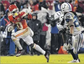  ?? Ed Zurga / Associated Press ?? Chiefs receiver tyreek Hill, who had a 36-yard td run and eight catches for 72 yards, gestures as he runs past Colts defenders on Saturday.