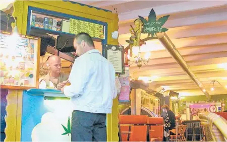  ?? RICK STEVES ?? In the Netherland­s, “coffeeshop” refers to a place where the Dutch gather to buy and smoke marijuana.