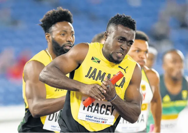  ?? RICARDO MAKYN/CHIEF PHOTO EDITOR ?? Jamaican sprinter Rasheed Dwyer (left) hands off the baton to teammate Tyquendo Tracey in the men’s 4x100-metre relay at the IAAF World Relays held in Yokohama, Japan, earlier this year.