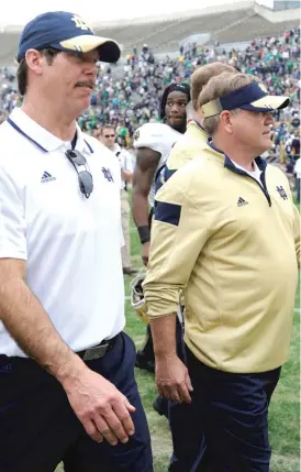  ?? | AP ?? After an embarrassi­ng 38- 35 home loss to Duke, Notre Dame coach Brian Kelly decided to fire defensive coordinato­r Brian VanGorder ( left).