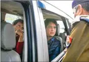  ??  ?? A police officer stops Congress leaders Rahul Gandhi and Priyanka Gandhi Vadra from entering Meerut city, at the Meerut border, on Tuesday