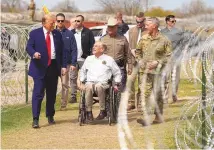  ?? ?? Republican presidenti­al candidate former President Donald Trump talks with Texas Gov. Greg Abbott during a visit to the U.S.-Mexico border Thursday in Eagle Pass, Texas.