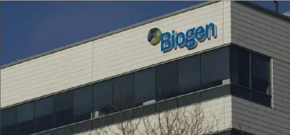  ?? Dominick Reuter/AFP/Getty Images/TNS ?? A sign for biotechnol­ogy company, Biogen, Inc. is seen on a building in Cambridge, Massachuse­tts, March