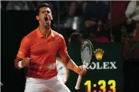  ?? The Associated Press ?? Serbia’s Novak Djokovic celebrates after winning his semifinal match against Norway’s Casper Ruud at the Italian Open Saturday in Rome.