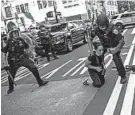  ?? WONG MAYE-E/AP ?? Police detain protesters in front of Trump Tower at a weekend rally in New York City. Demonstrat­ors took to the streets in a number of cities to protest the death of George Floyd in Minneapoli­s.