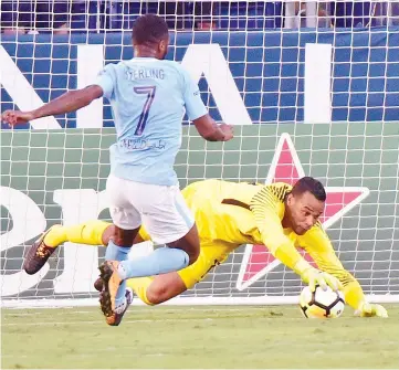  ??  ?? Hugo Lloris #1 of Tottenham dives to keep a ball away from Raheem Sterling #7 of Manchester City against of Tottenham during the second half of the 2017 Internatio­nal Champions Cup Presented by Heineken at Nissan Stadium on July 29, 2017 in...