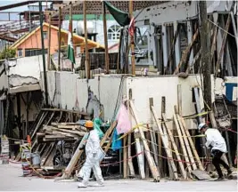  ?? MOISES CASTILLO/AP ?? Police inspect part of the collapsed Enrique Rebsamen school in Mexico City.