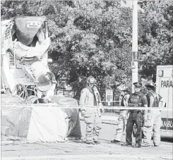  ?? HAMILTON SPECTATOR FILE PHOTO ?? Police and firefighte­rs on the scene of a fatal collision where a 77-year-old cyclist was killed by cement truck on King Street just west of Queen Street in August.