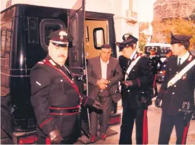  ?? Picture: EPA-EFE ?? THE BOSS. Sicilian Salvatore ‘Toto’ Riina being detained by members of the Carabinier­i military in Palermo, Sicily in 1993.