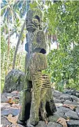  ?? ?? Sacred site: a carved figure at the entrance to a ceremonial meeting place on Nuku Hiva