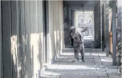  ?? AFP ?? A worker cleans the deserted corridor of Esteqlal High School in Kabul yesterday.