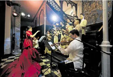  ?? —PHOTOS BY SHERARD YU ?? Anya Lagman conducts the Philippine Madrigal Singers and Manila Philharmon­ic Orchestra Quartet.