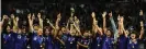  ??  ?? Homare Sawa holds the World Cup aloft in Frankfurt. Photograph: Patrik Stollarz/ AFP via Getty Images