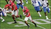  ?? CURTIS COMPTON/AJC 2020 ?? UGA running back Zamir White, breaking free for a 75-yard touchdown run on the first play from scrimmage against Florida last season, is the most experience­d member of a deep backfield.
