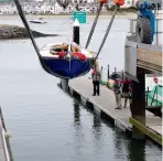  ??  ?? The completed Alys is lowered into the water for the first time.