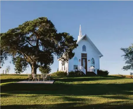  ?? Natalie Lacy Lange ?? Linda O'Neal and Rob Rosenbaum wanted to convert an old church into a home but instead went with a new-build guesthouse made to look like an old chapel.