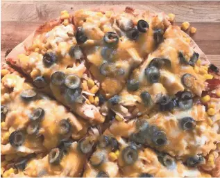  ?? DANIEL HIGGINS/USA TODAY ?? Chicken And Corn Pizza is in essence a taco pizza.