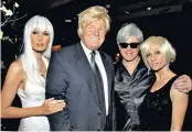  ??  ?? Melania and Donald Trump with Woody Johnson and his wife, Suzanne, at the ambassador’s fancy dress 60th birthday party
