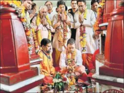  ?? PTI ?? Congress president Rahul Gandhi, along with party leaders Kamal Nath and Jyotiradit­ya Scindia, offers prayers at Pitambara Peeth in Datia, Madhya Pradesh, on Monday. &gt;&gt;P4