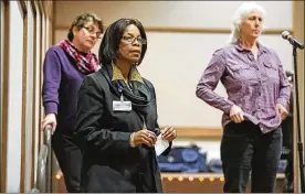  ?? DAVE ZAPOTOSKY / THE (TOLEDO) BLADE ?? Patricia Hogue (center) listens to Michele Wheatly, former West Virginia University provost, as she answers her question about student body diversity in February 2015 on the University of Toledo Health Science campus, the former Medical College of Ohio.