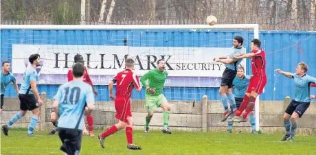  ?? Paul Watson ?? Runcorn Town’s rearguard is put under pressure in the New Year’s Eve clash against Squires Gate.