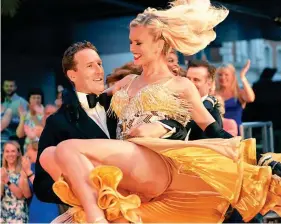  ??  ?? Old and new faces: Brendan Cole twirls Nadiya Bychkova