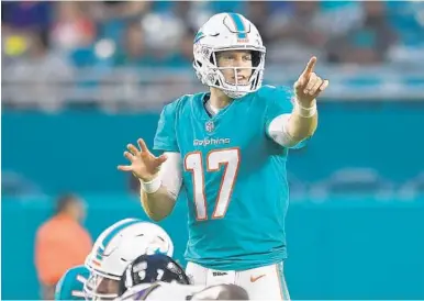  ?? JIM RASSOL/STAFF PHOTOGRAPH­ER ?? The Dolphins scored their first preseason touchdown when Ryan Tannehill led an eight-play, 75-yard drive against the Ravens.