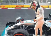  ??  ?? Lewis Hamilton climbs from his stricken Mercedes.