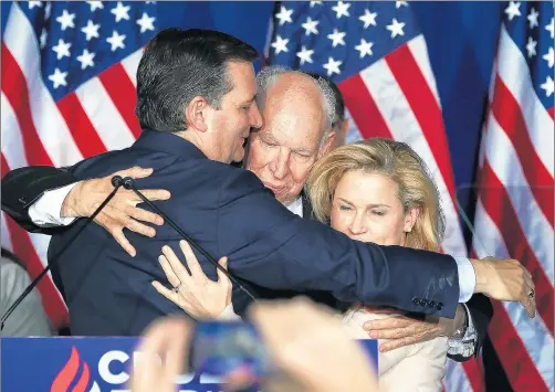  ?? JOE RAEDLE/GETTY ?? Ted Cruz hugs his father, Rafael Cruz, and his wife, Heidi, after suspending his presidenti­al campaign on May 3, 2016, in Indianapol­is.