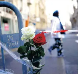  ?? PICTURE: AP ?? Roses tied to a barrier near the attack scene in Nice, France, offer a poignant memorial to the dead.