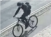  ??  ?? Brian Healless cycling away from Parbold Hill after the murder of Alex Davies.