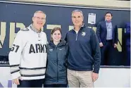  ?? Army Athletics ?? Army trainer Rachel Leahy with West Point superinten­dent Steve Gilland, left, and athletic director Mike Buddie.