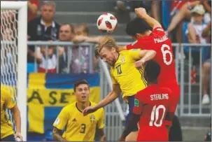  ?? The Associated Press ?? HEADED TO SEMIS: England’s Harry Maguire (8) scores his side’s opening goal in a 2-0 quarterfin­al match Saturday against Sweden in the 2018 FIFA World Cup in Samara, Russia. England advanced to the semifinals for the first time since 1990.