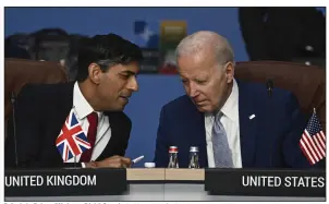  ?? (AP/Paul Ellis) ?? Britain’s Prime Minister Rishi Sunak (left) and U.S. President Joe Biden speak at the start of the North Atlantic Council meeting during the NATO Summit in Vilnius, Lithuania, in July 2023.