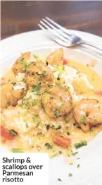  ??  ?? Shrimp & scallops over Parmesan risotto