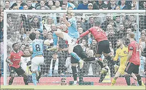 ?? (Pic: Daily Mail) ?? Christian Eriksen (R) was left grounded as Erling Haaland soared above the Manchester United defence to head home Manchester City’s second goal at the Etihad Stadium.