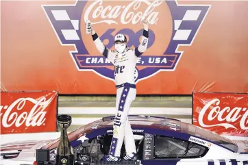  ?? GERRY BROOME/ASSOCIATED PRESS ?? Brad Keselowski celebrates after winning the Coca-Cola 600, the NASCAR Cup Series auto race at Charlotte Motor Speedway early Monday in Concord, N.C.