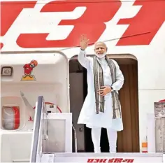  ?? PTI ?? Prime Minister Narendra Modi waves before his departure from New Delhi on Monday for his visit to Germany, Spain, Russia and France