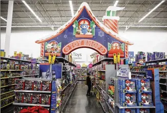  ?? PATRICK T. FALLON/BLOOMBERG 2018 ?? Toys await buyers at a Walmart in Burbank, California, ahead of Black Friday in 2018. This year, besides coping with supply chain hangups, the toy industry is also dealing with soaring demand.