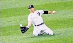  ?? N.Y. Post: Charles Wenzelberg ?? STILL GOT IT: Brett Gardner makes a sliding grab in the third inning of Thursday’s Yankees win over Toronto.