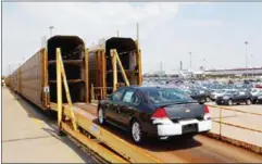  ?? CHRIS YOUNG/THE NEW YORK TIMES ?? A Chevrolet Impala is loaded onto a rail car at the General Motors plant in Oshawa, Ontario.