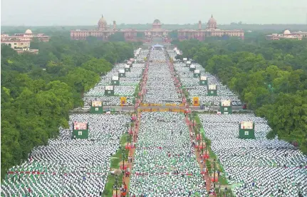 ?? Reuters ?? Tens of thousands of people take part in a yoga session on the Internatio­nal Yoga Day in New Delhi yesterday.