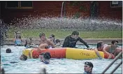  ?? ?? Hosed off: Lifeguards amusing themselves with the hose.