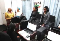  ?? ?? First Lady Dr Auxillia Mnangagwa takes Botswana First Lady Mrs Neo Jane Masisi on a tour of the National Gender-Based 575 call centre at Zimbabwe House on Thursday. Pictures: John Manzongo