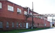  ?? STAFF PHOTO BY ERIN O. SMITH ?? Caution tape is wrapped around the abandoned Coats American building Monday in Rossville.