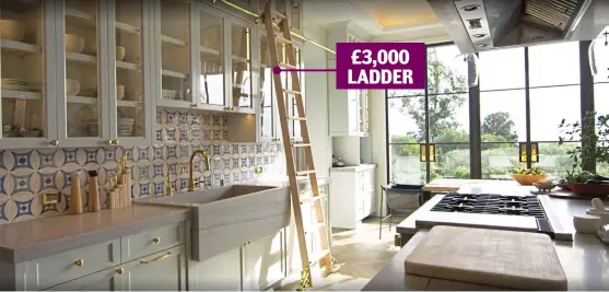  ?? ?? £3,000 LADDER
A step too far? The ladder in the kitchen rolls along a golden rail from one end to the other to give easy access to the cabinets