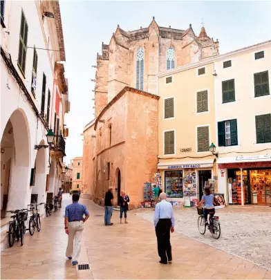  ?? ?? RIGHT: Street life in Ciutadella, overlooked by Menorca Cathedral