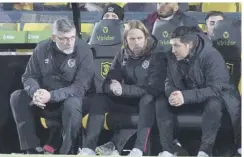  ??  ?? Craig Levein, Austin Macphee and Liam Fox try to digest the loss.