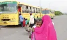  ?? Photograph: Harish Tyagi/EPA ?? A bus for migrant workers stops to pick up passengers in Noida, south-east of New Delhi.